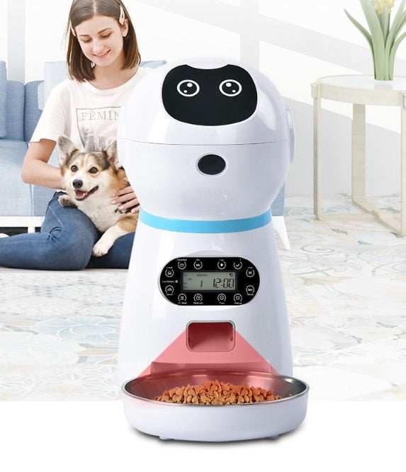Pet feeder shaped like a robot with a woman and dog in the background