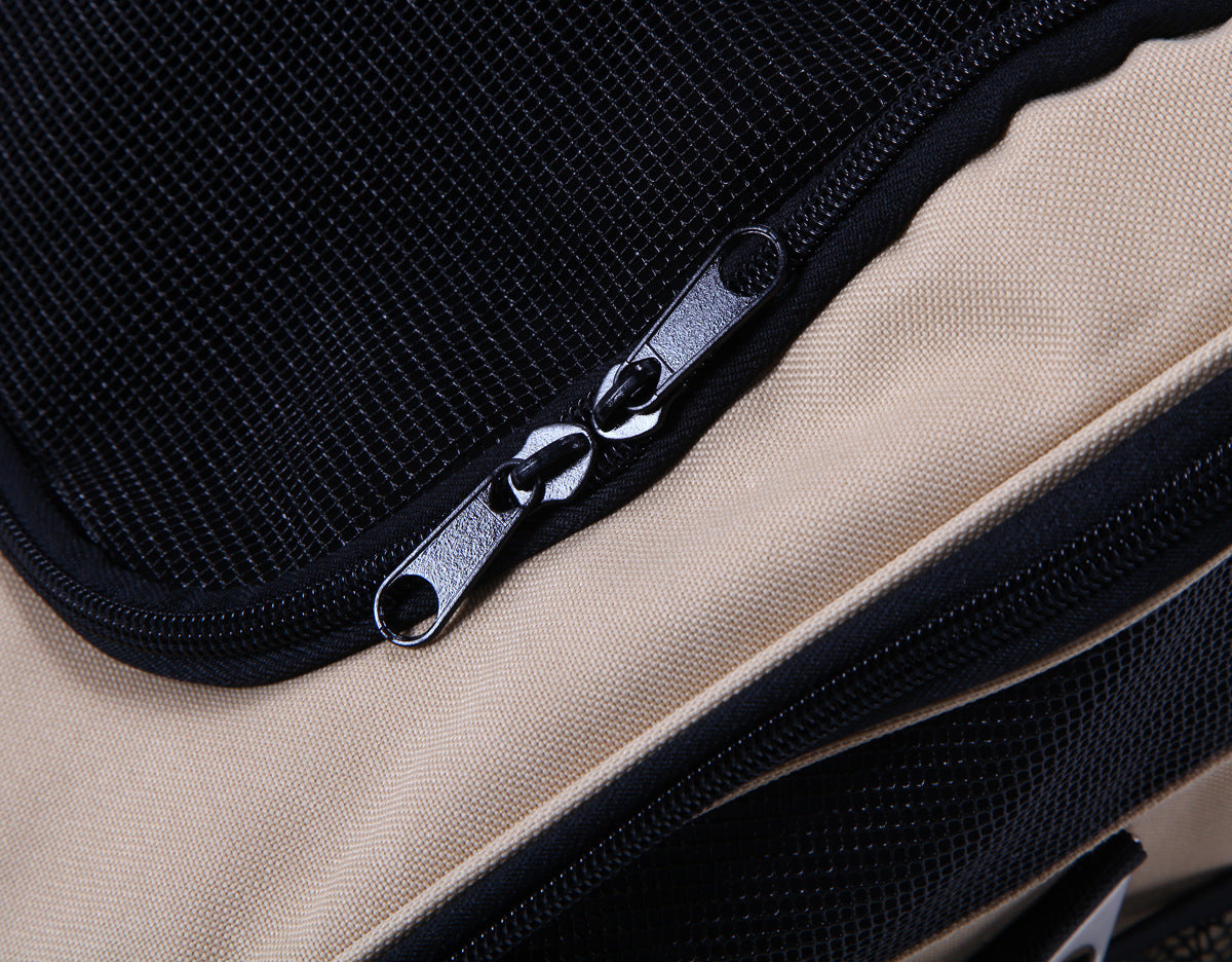 Close-up of a zipper on a black and beige bag
