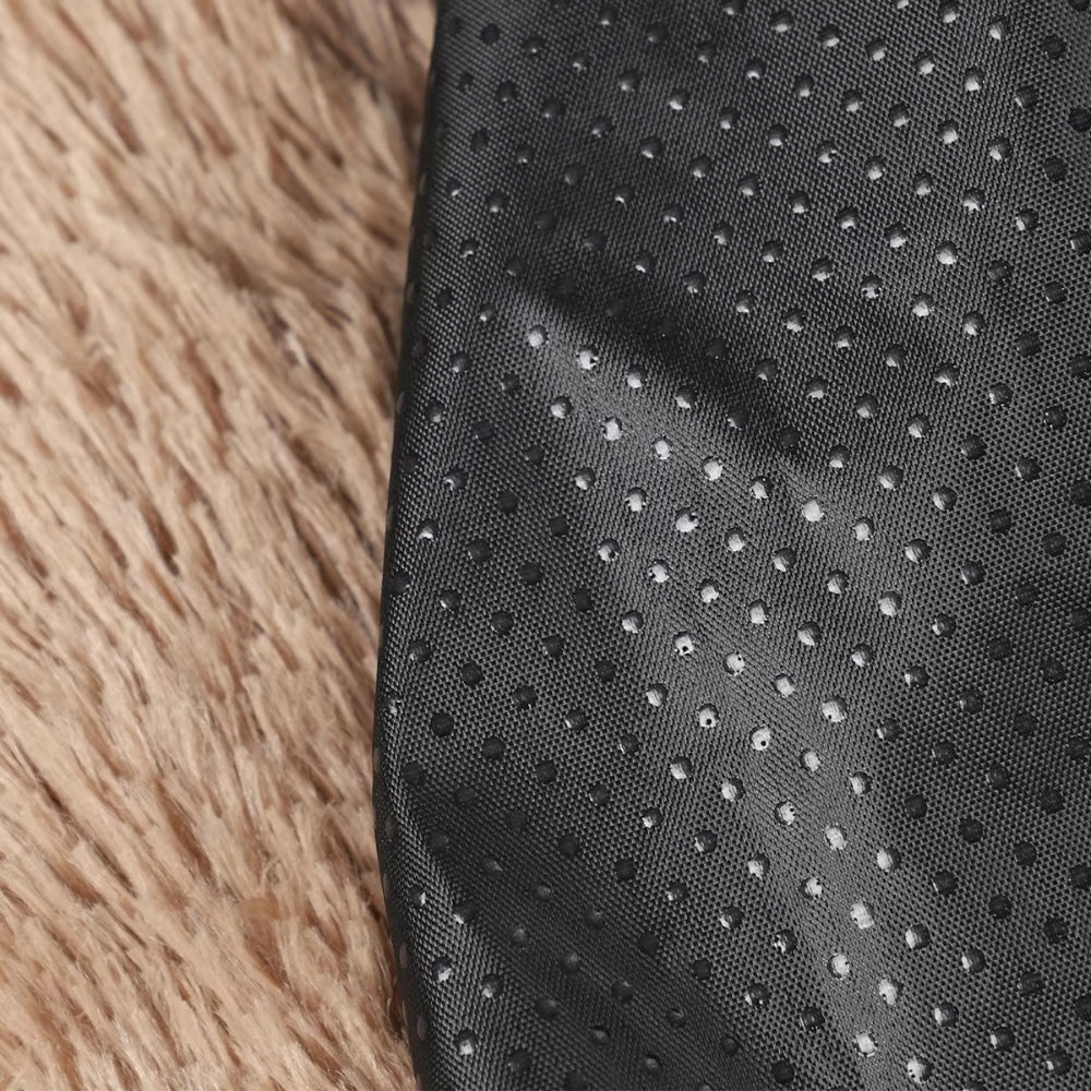 Close up of Purrfect Pet Haven paw-shaped pet bed showing beige faux fur top and black non slip dotted backing