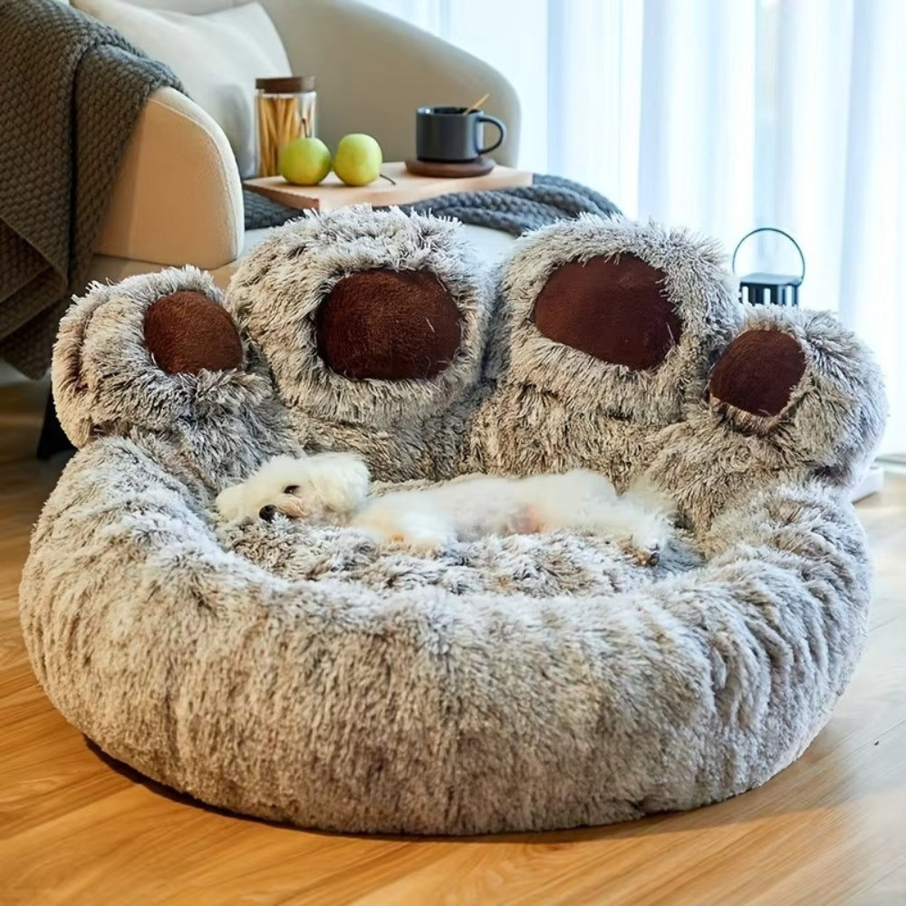 Purrfect Pet Haven gray fluffy paw-shaped pet bed with raised brown pads and small white dog sleeping