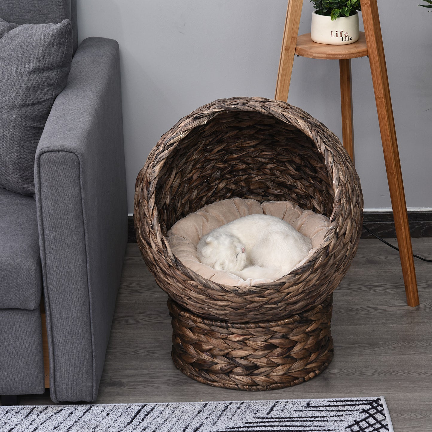 Wefulfil Cozy Wicker Pet Bed Dome with plush cushion featuring a white cat sleeping inside