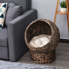 Wefulfil Cozy Wicker Pet Bed Dome with soft cushion and white cat resting inside near gray sofa