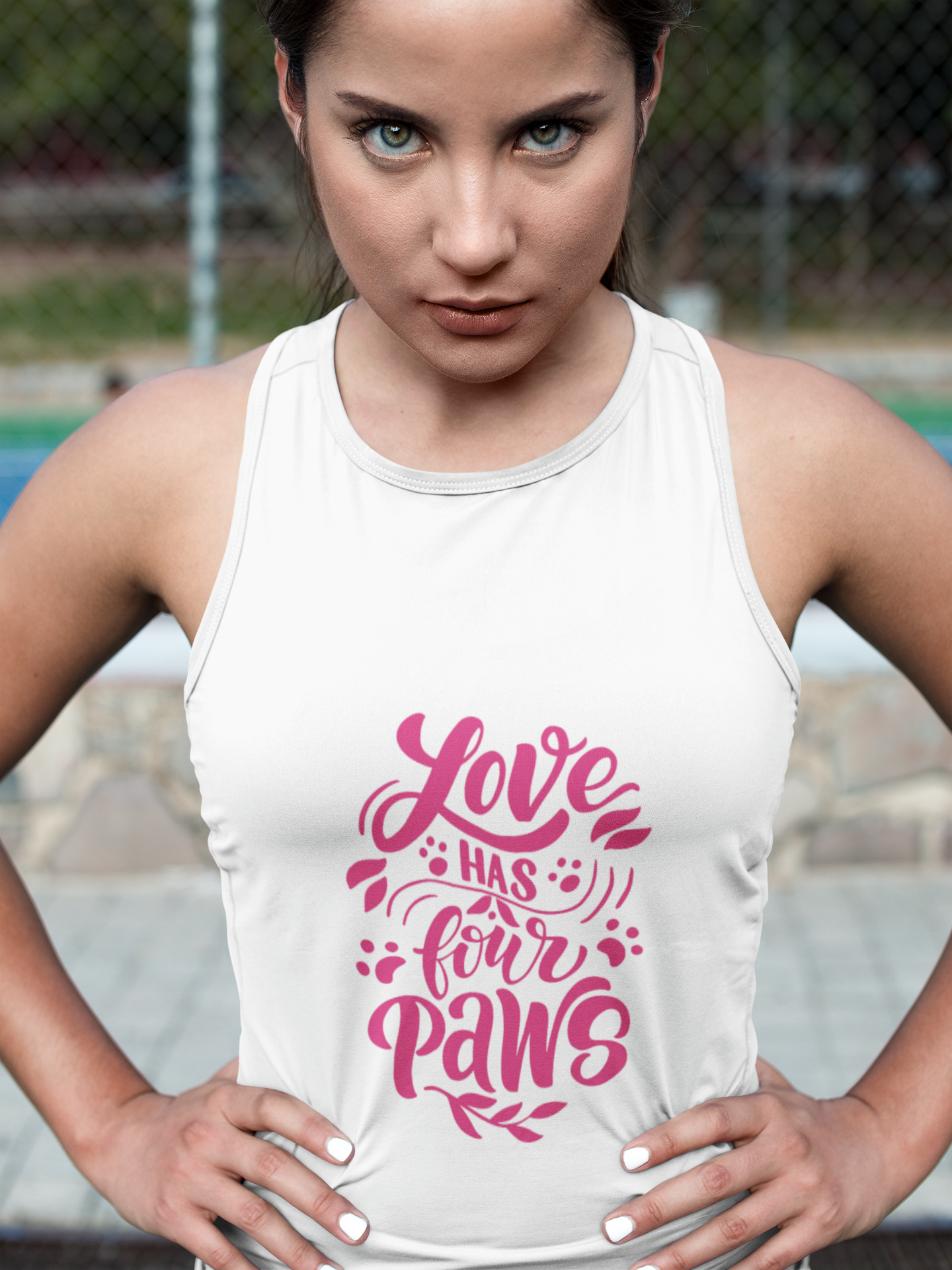 White Printify tank top with pink Love Has Four Paws graphic worn by woman outdoors