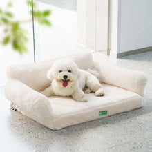 White fluffy dog lying comfortably on a cream orthopedic egg foam sofa pet bed indoors