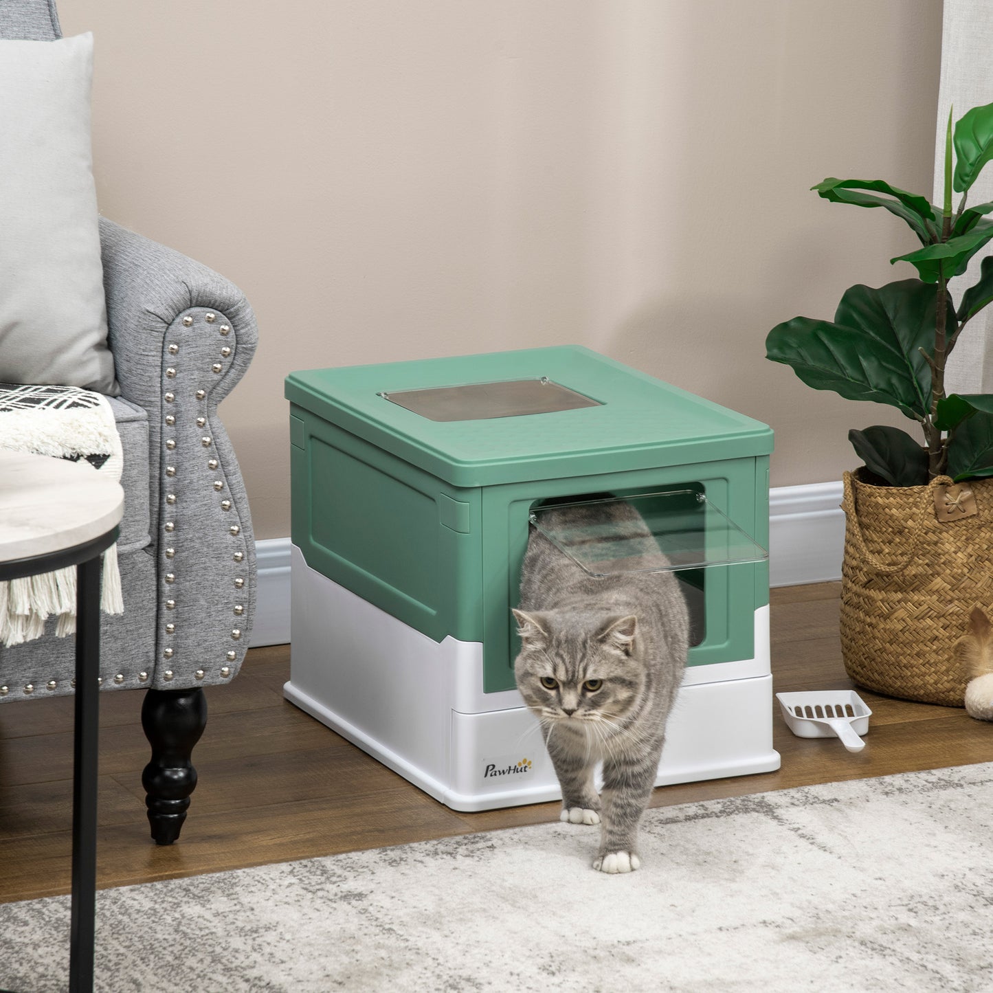Wefulfil fully enclosed cat litter box in green and white with clear flap door and gray tabby cat exiting