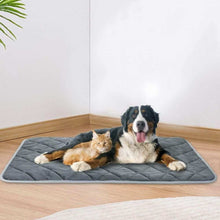 Purrfect Pet Haven Self Heating Pet Pad gray quilted mat with dog and cat lounging on hardwood floor