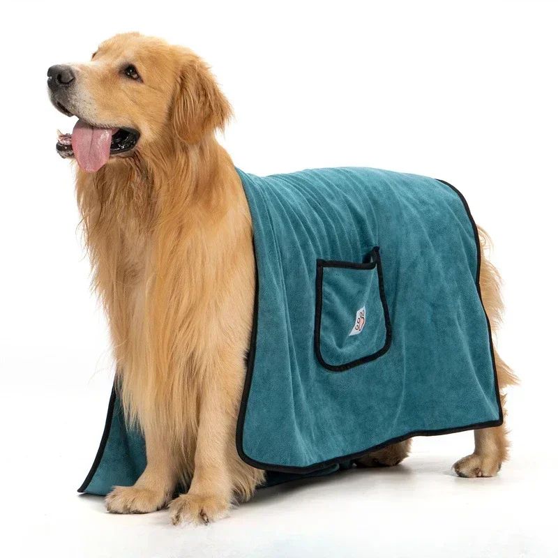 Golden Retriever wearing teal dog bathrobe towel quick dry with pocket and black trim for post bath drying