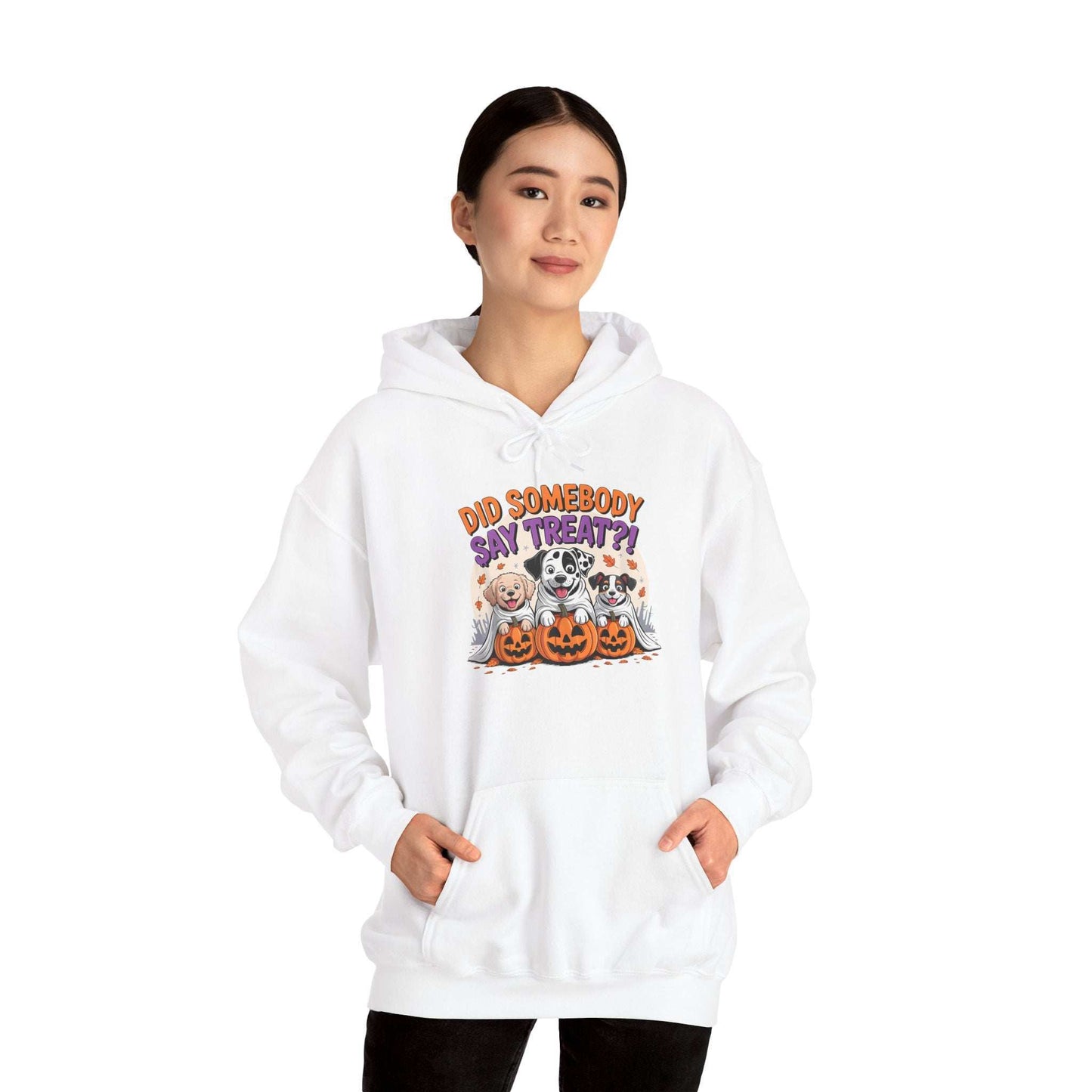 Printify white hoodie featuring three dogs with pumpkins and Did Somebody Say Treat text Halloween Dog Sweatshirt