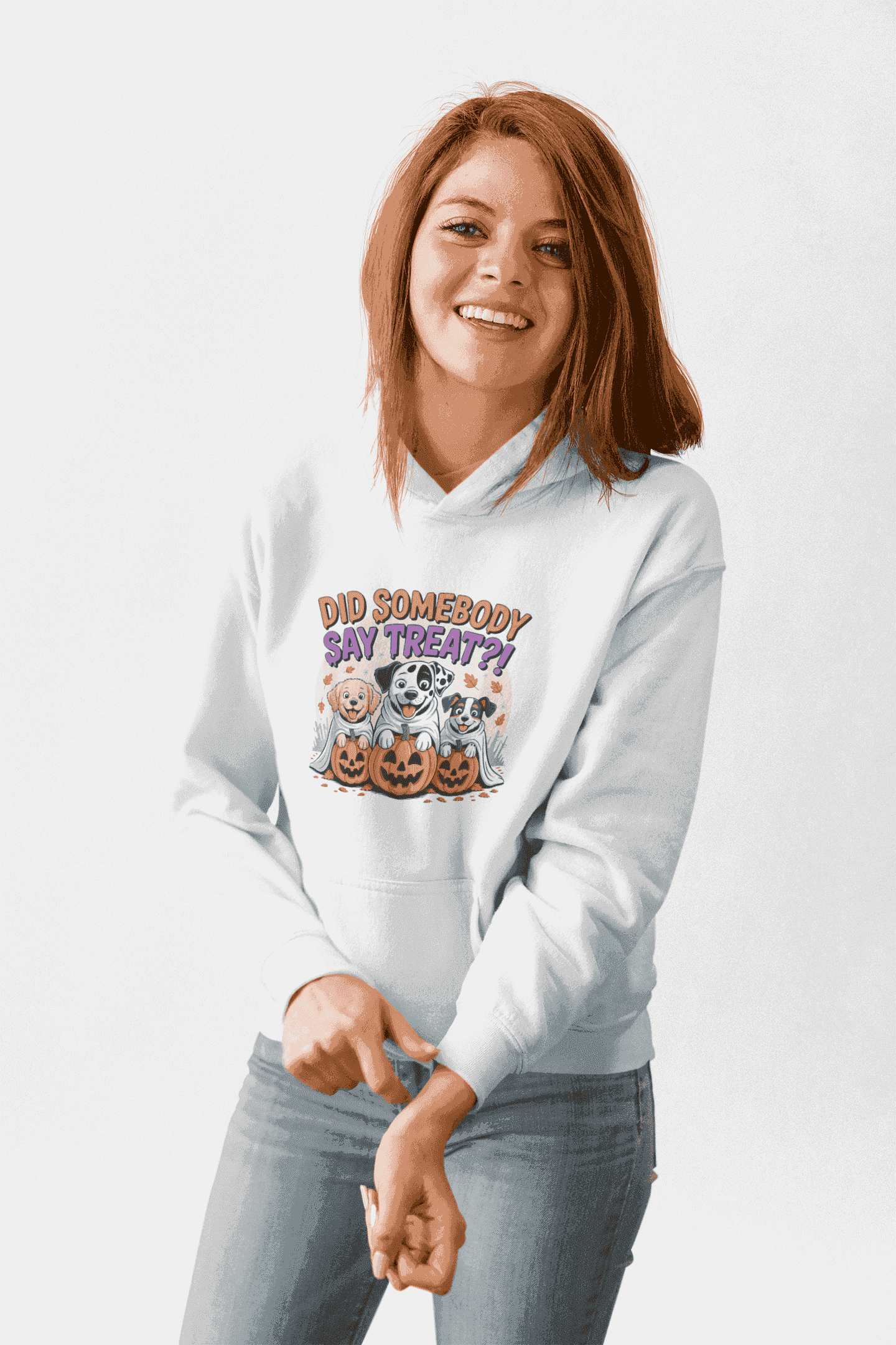 Printify white hoodie featuring Halloween Dog Sweatshirt graphic with three dogs in jack o lanterns and treat text