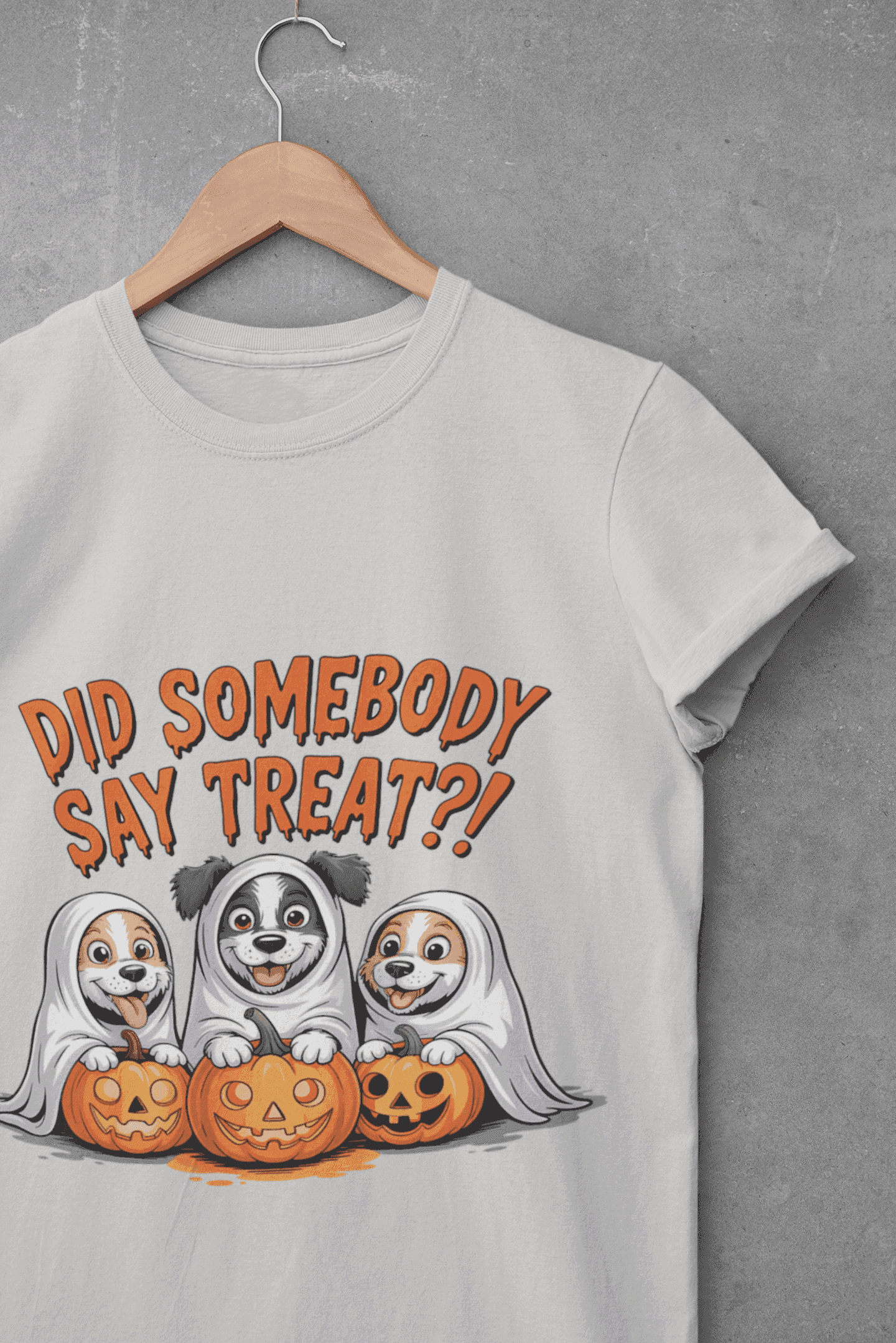 Spooky Halloween Dog Tee white shirt on hanger showing three dogs as ghosts with carved pumpkins