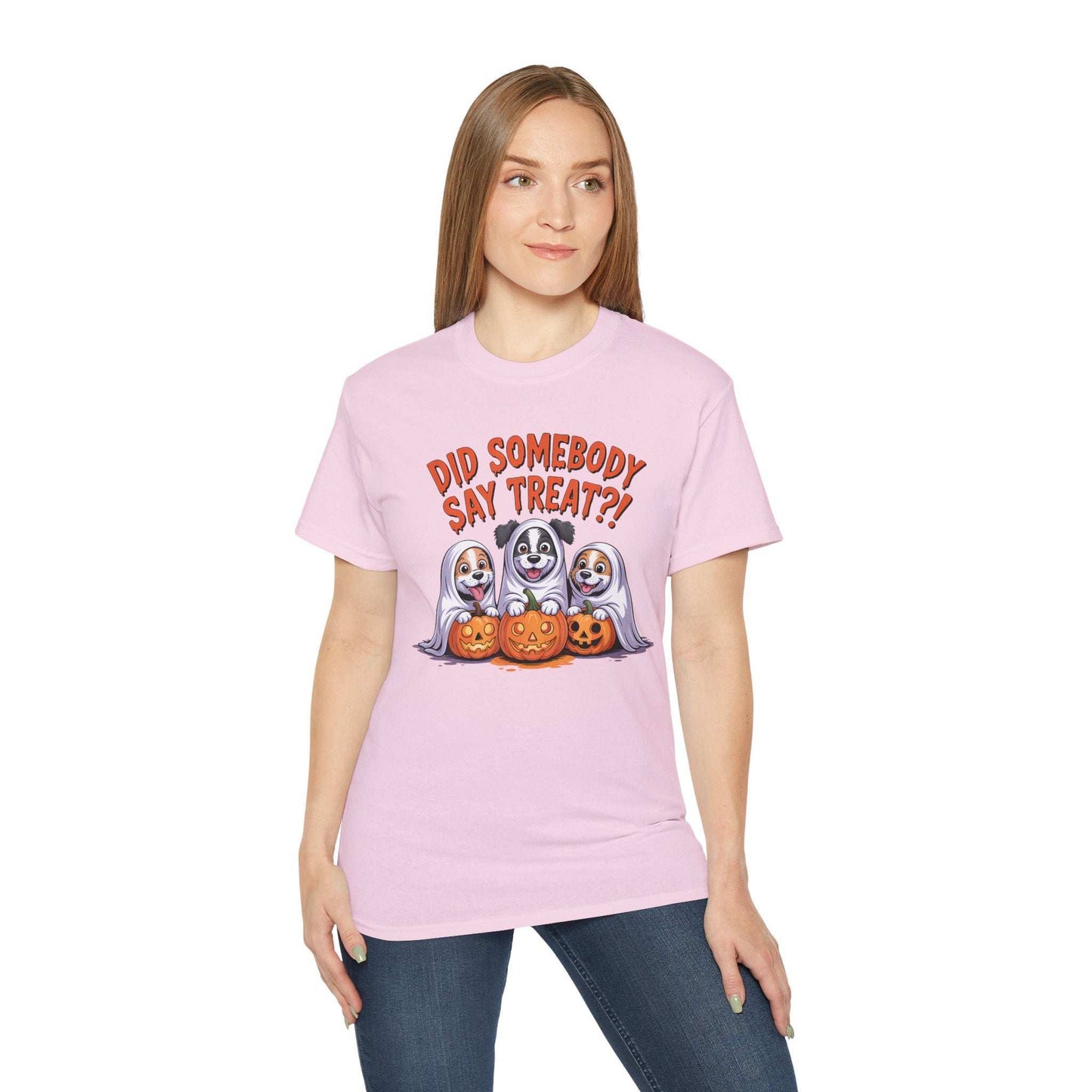 Spooky Halloween Dog Tee on a woman featuring three dogs in ghost costumes with jack o lanterns and treat text
