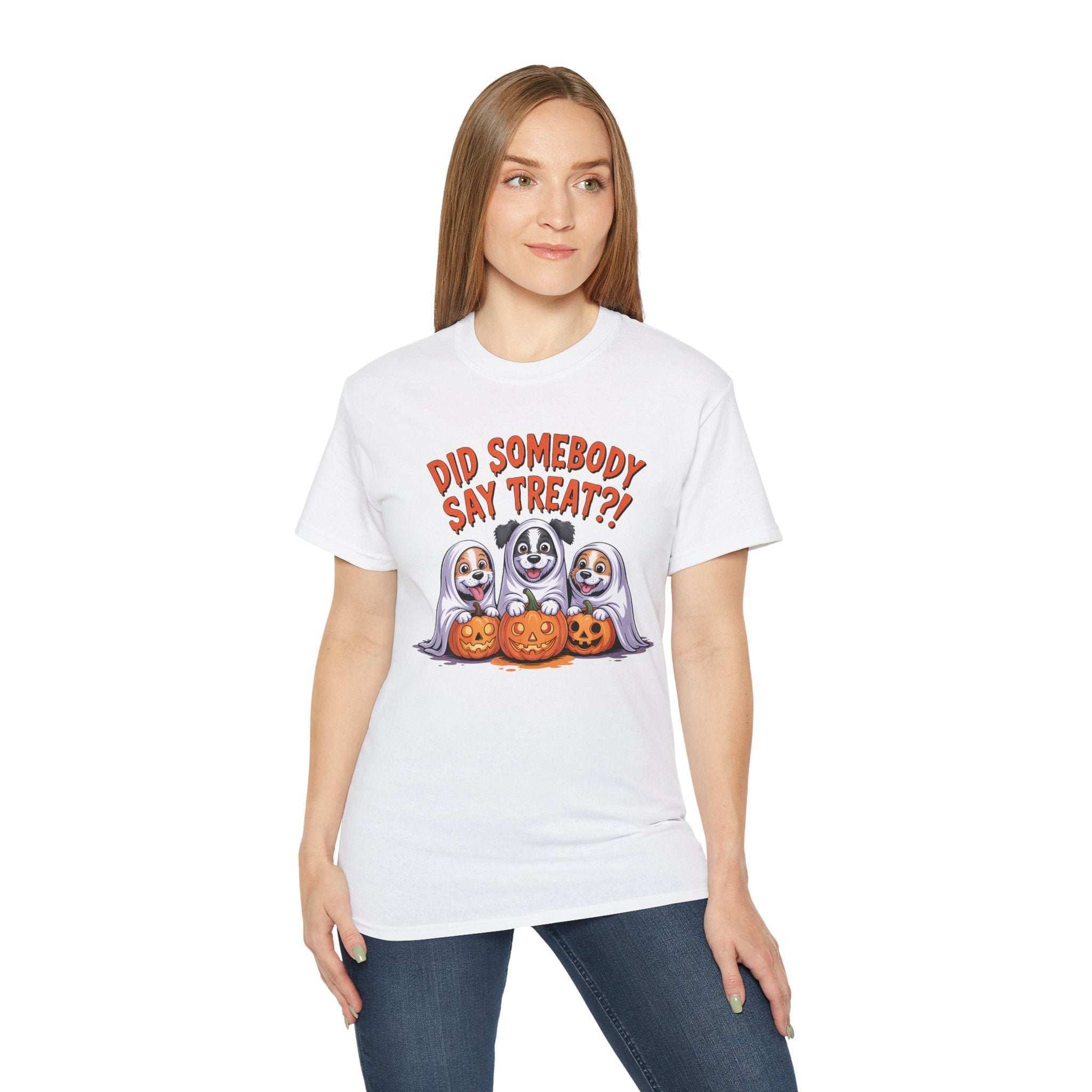 Printify Spooky Halloween Dog Tee on woman model white shirt featuring three dogs in ghost costumes with jack o lanterns