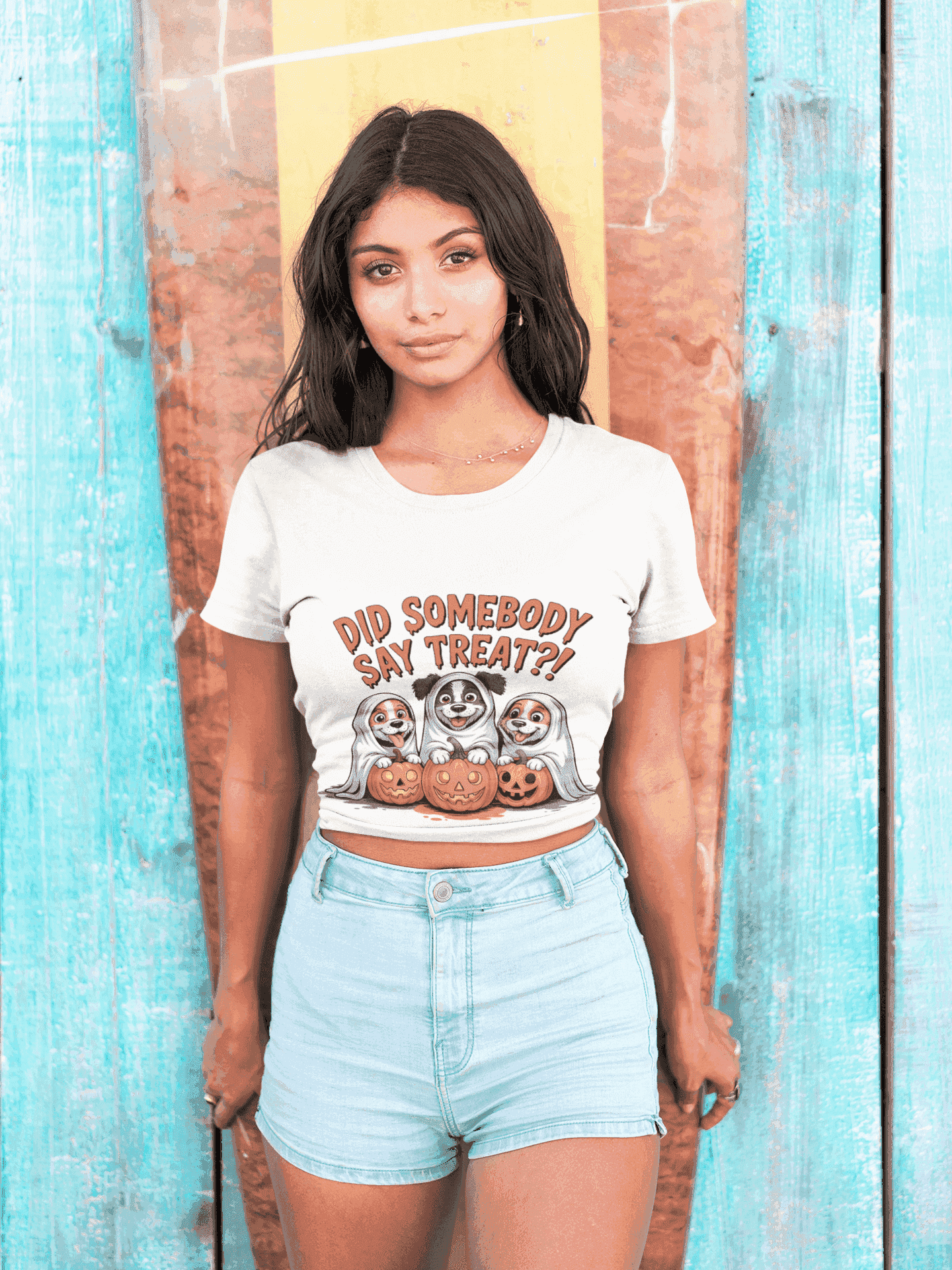 Spooky Halloween Dog Tee on model white cropped T shirt with ghost dogs pumpkins Did somebody say treat print