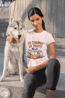 Printify Spooky Halloween Dog Tee in light pink worn by woman sitting with husky on concrete steps