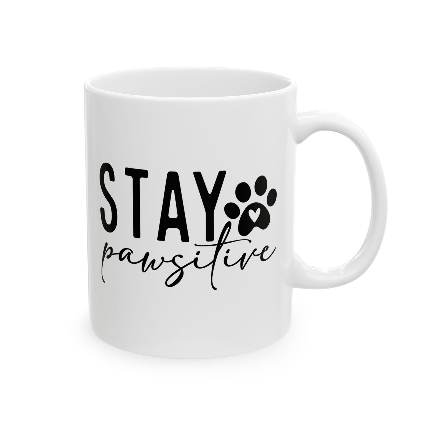 White ceramic Stay Pawsitive Mug with black text and paw print design