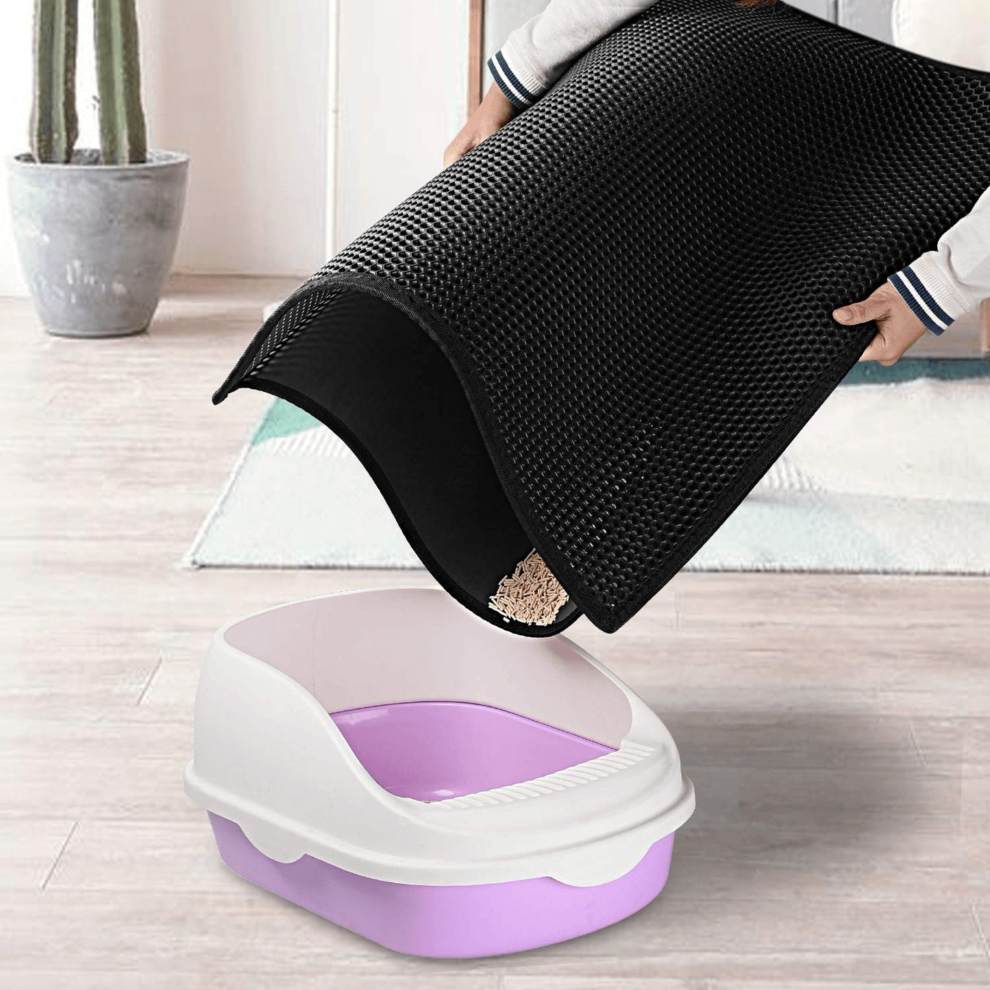 Wefulfil black Trapping Kitty Litter Mat capturing litter debris above purple and white cat litter box