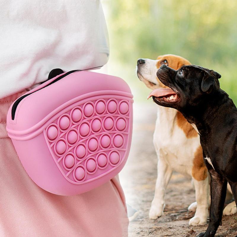 Pink Wefulfil Treat Pouch Bag worn on waist with popping bubbles and two attentive dogs