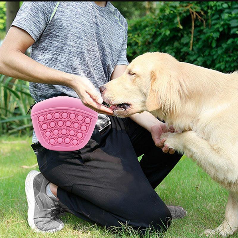 Wefulfil pink Treat Pouch Bag worn by person kneeling while feeding treat to golden retriever dog outdoors