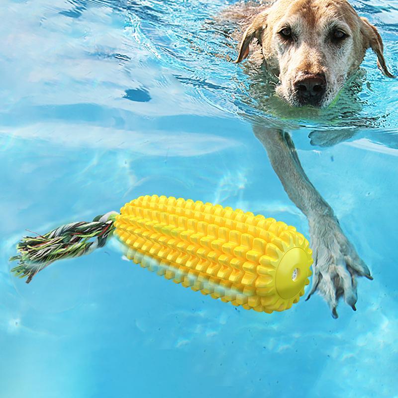 Wefulfil Corn-Shaped Dog Chew Toy floating in pool with dog swimming towards it