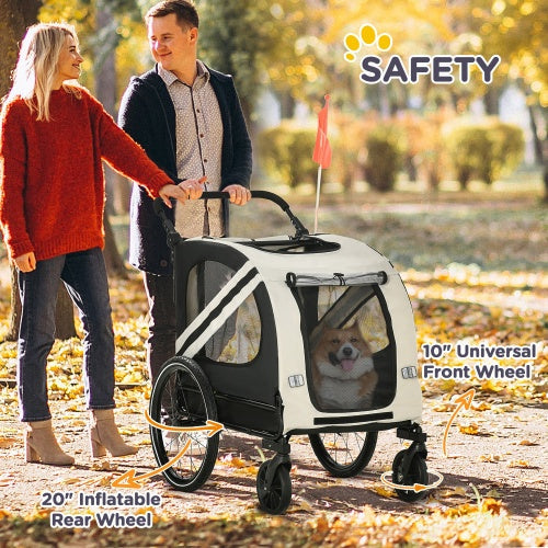 Couple walking in an autumn park pushing Pet Buggies stroller with small dog inside showing inflatable rear wheels