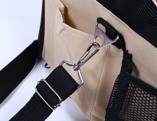 Close-up of a beige bag with black strap and mesh pocket on a white background