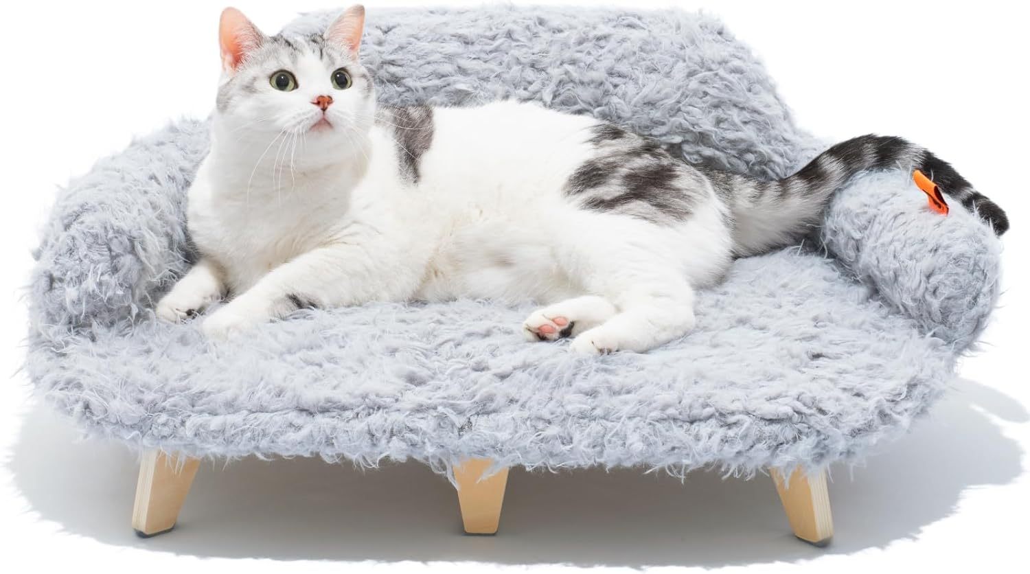 Cat lying on a fluffy gray pet bed with wooden legs against a white background