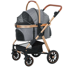Gray pet stroller with gold accents on a white background
