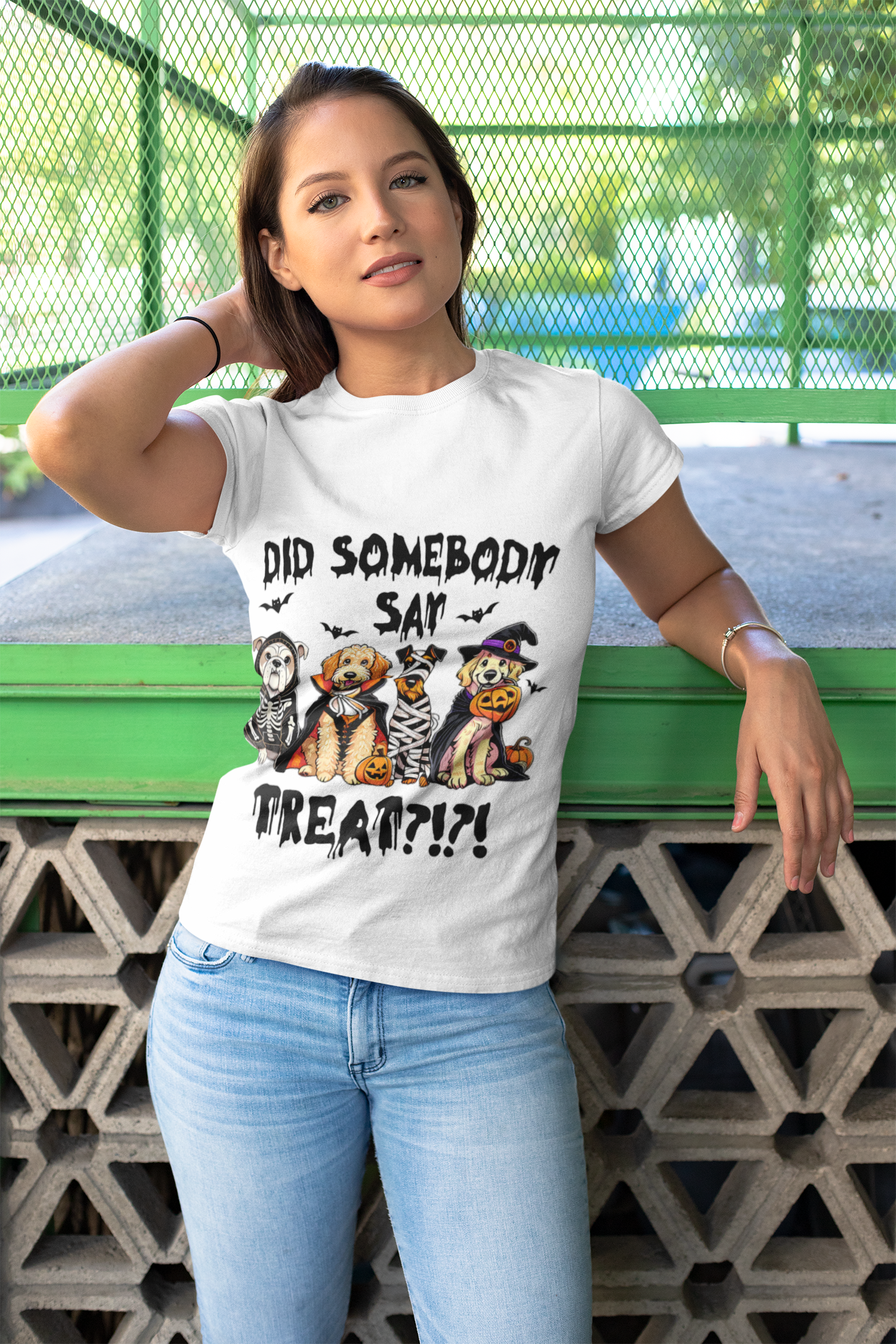 Woman wearing Printify Heavy Cotton T-Shirt white Halloween graphic with three dogs in costumes and Did Somebody Say Treat text