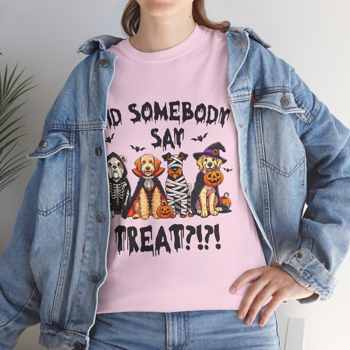 Printify Heavy Cotton T-Shirt in pink featuring four dogs in Halloween costumes with pumpkins and spooky treat text