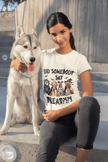 Young woman sitting on concrete steps with husky wearing a white Heavy Cotton T-Shirt featuring a Halloween pets treat graphic