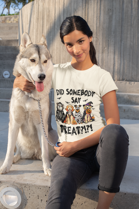 Young woman sitting on concrete steps with husky wearing a white Heavy Cotton T-Shirt featuring a Halloween pets treat graphic
