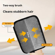 Two-way brush with text indicating its use for cleaning stubborn hair on a neutral background.
