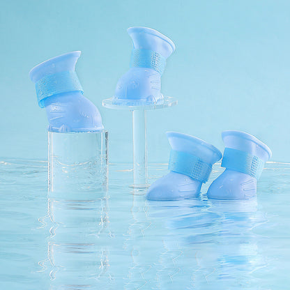 Wefulfil Dog 4 Piece Rain Boots in blue waterproof design floating on water