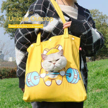 Yellow open hole cat carrier tote bag by Wefulfil with a cat peeking out of the front hole