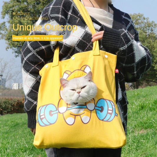 Yellow open hole cat carrier tote bag by Wefulfil with a cat peeking out of the front hole