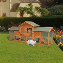 Extra-large wooden rabbit hutch with natural fir color in sunny backyard