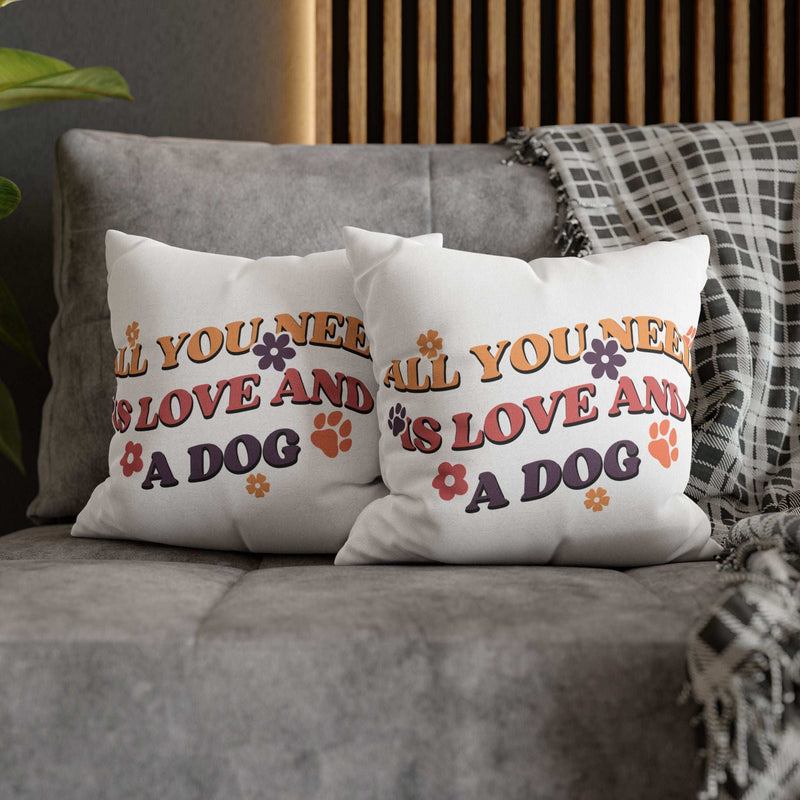 Cozy Throw Pillow pair with retro All You Need Is Love And A Dog print paw prints and flowers on gray sofa