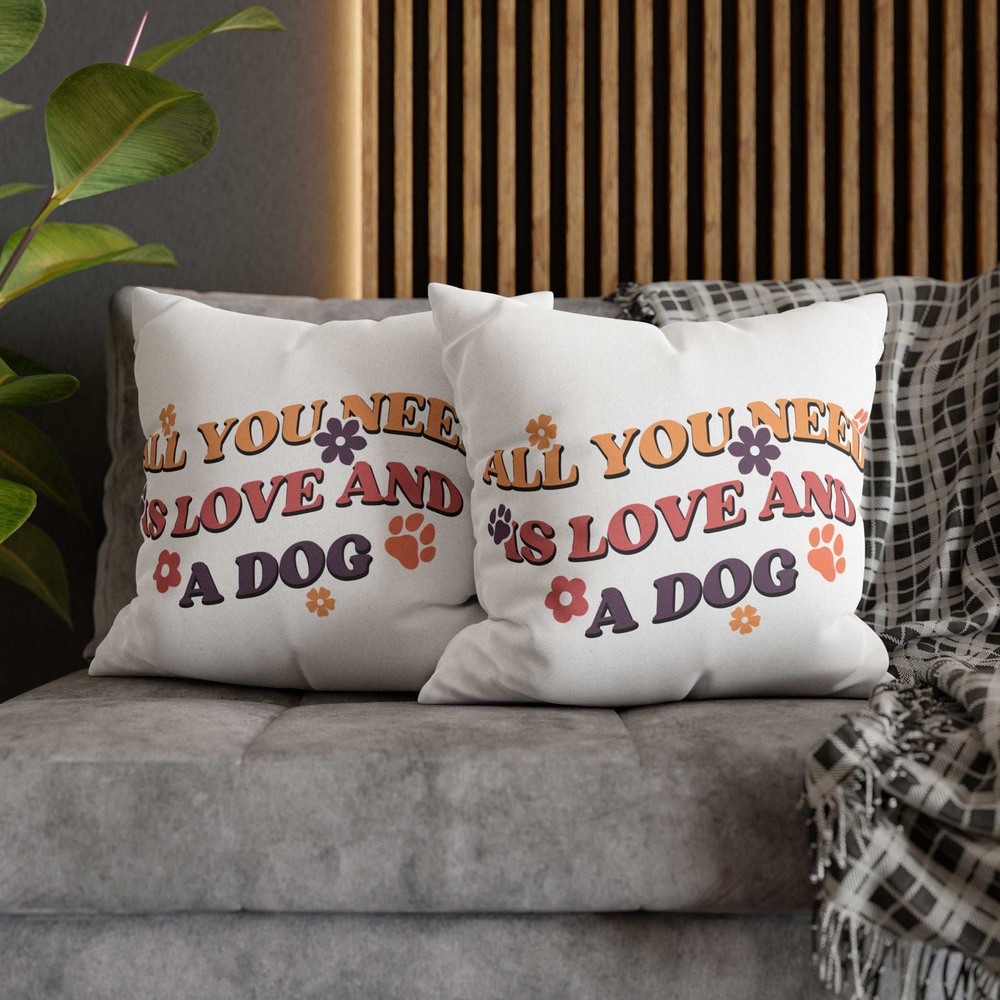 Cozy Throw Pillow pair on gray sofa with retro All You Need Is Love And A Dog print and paw accents