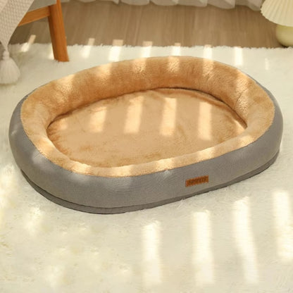 Purrfect Pet Haven Plush Oval Pet Bed with bolstered rim and tan plush interior on rug