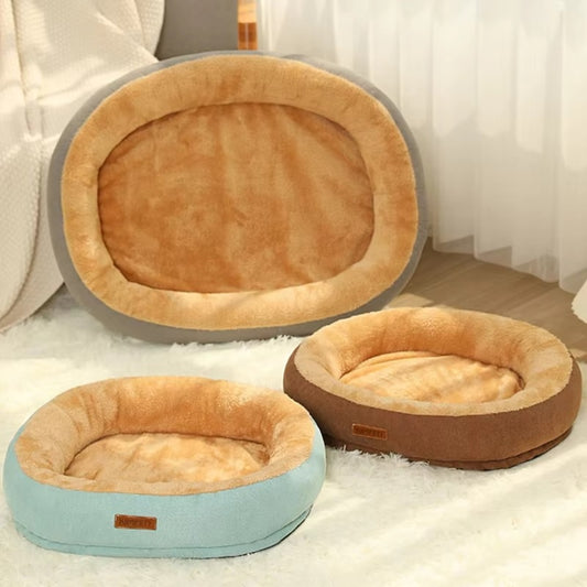 Purrfect Pet Haven Plush Oval Pet Bed trio in tan with gray and mint and brown outer rings on a cozy rug