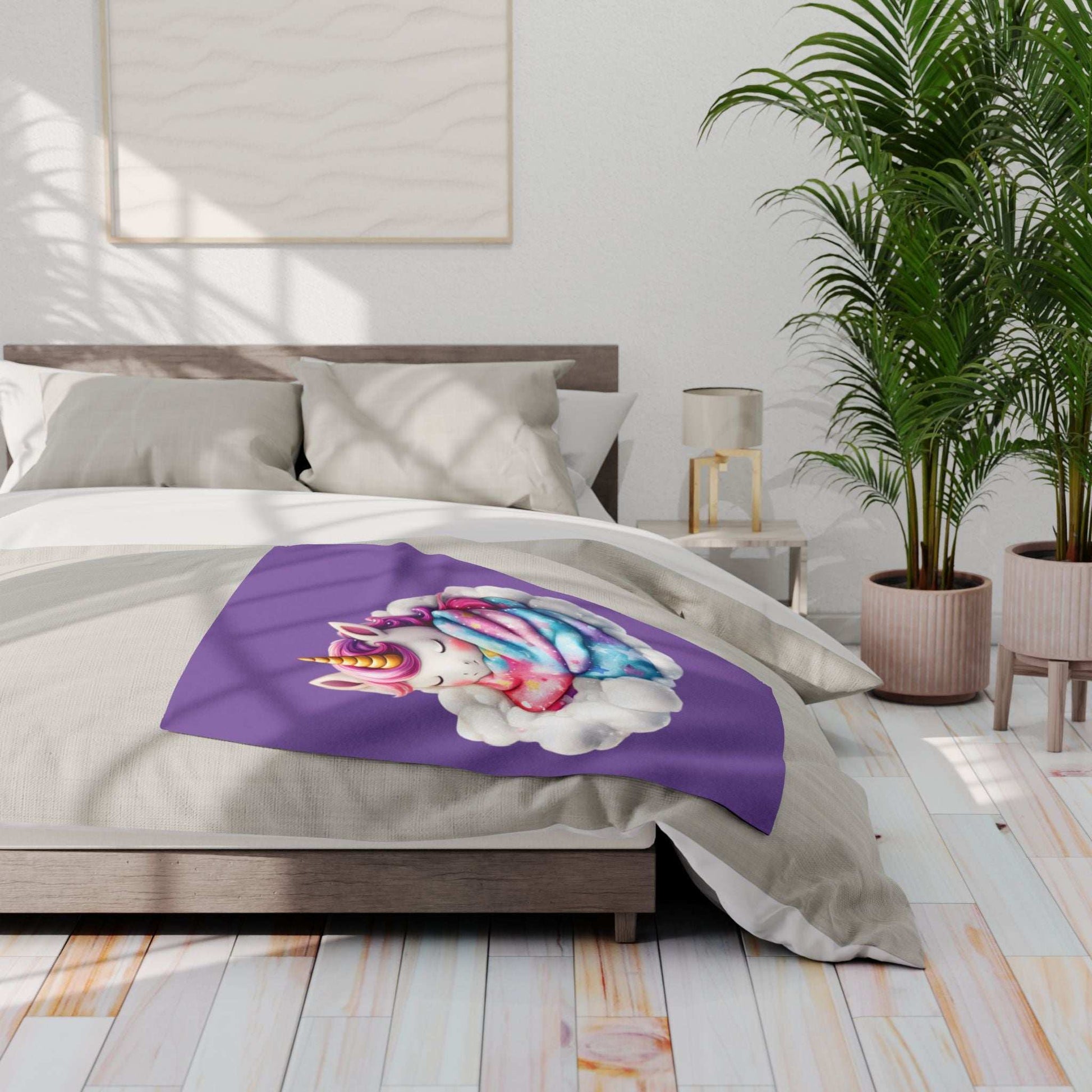 Purple Cozy Throw for Kids with colorful unicorn on cloud design draped on neutral bed in bright modern bedroom