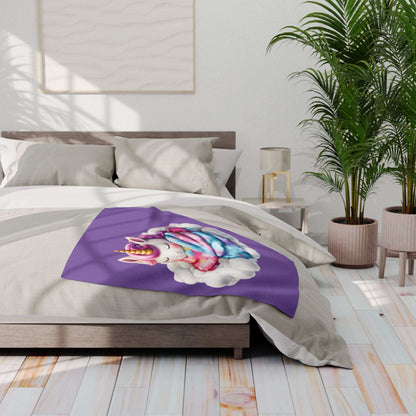 Purple Cozy Throw for Kids with colorful unicorn on cloud design draped on neutral bed in bright modern bedroom