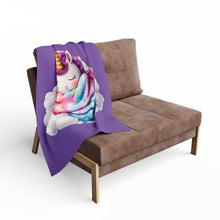 Printify Cozy Throw for Kids purple blanket draped on brown sofa featuring sleeping unicorn on cloud design