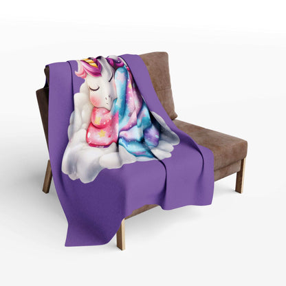 Cozy Throw for Kids purple unicorn blanket on cloud design draped over brown accent chair