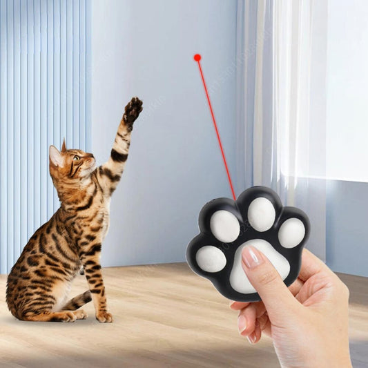 Purrfect Pet Haven Interactive Cat Toy paw shaped laser controller held in hand with Bengal cat chasing red dot