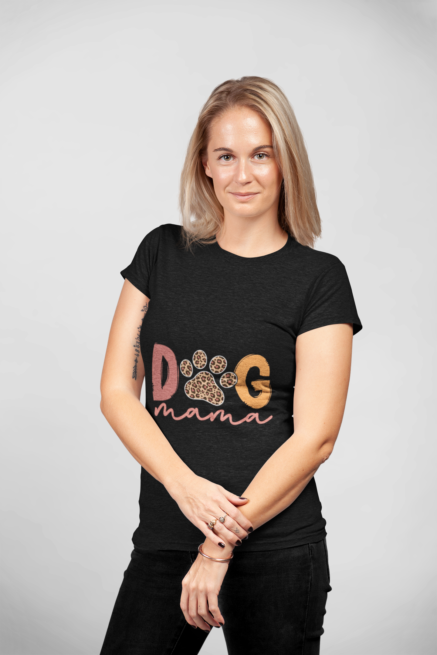 Printify Dog Mama Tee black fitted t shirt with leopard paw and script design on woman