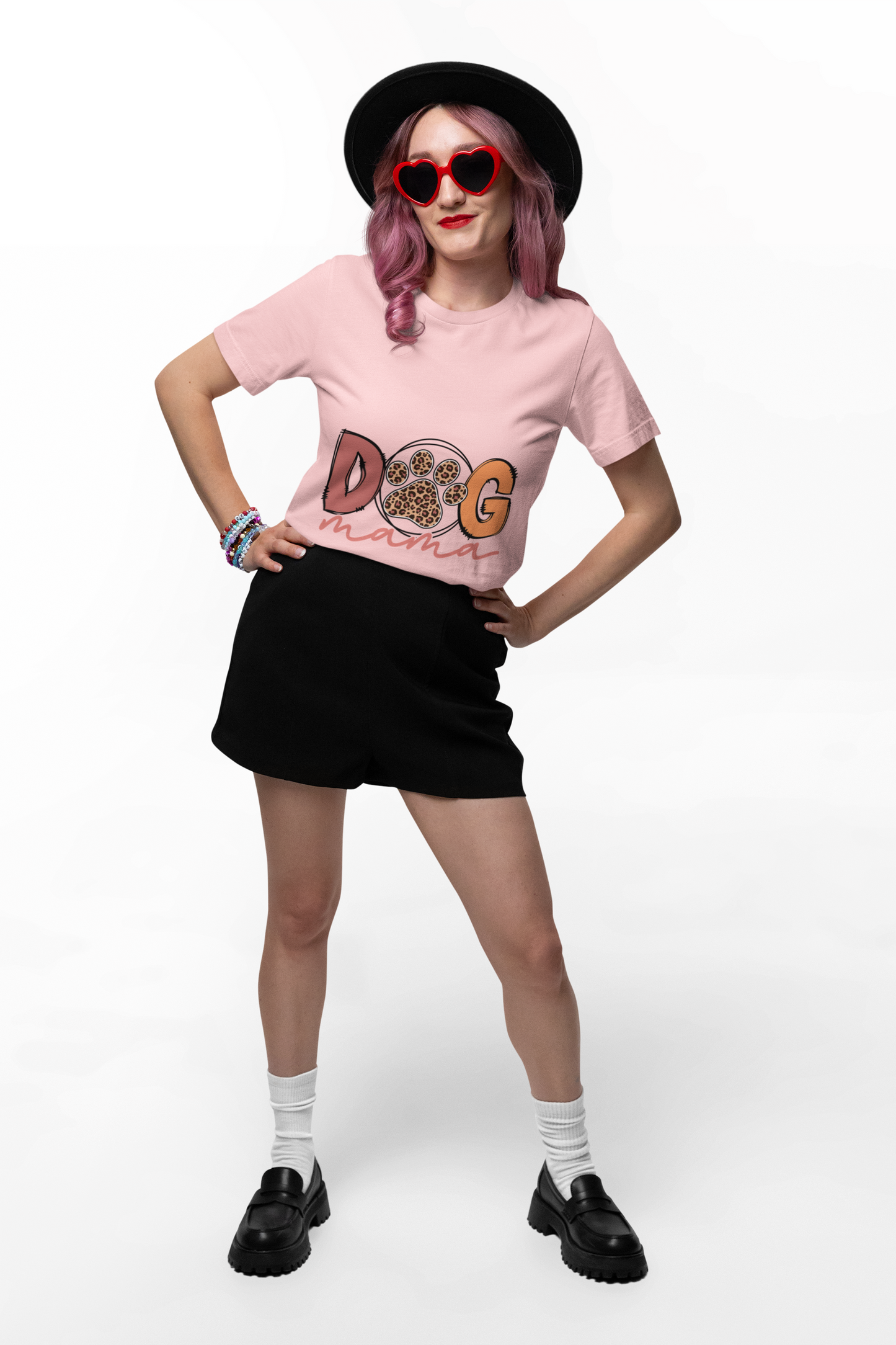 Printify Dog Mama Tee pink crewneck worn by model with black hat heart sunglasses showing paw print graphic