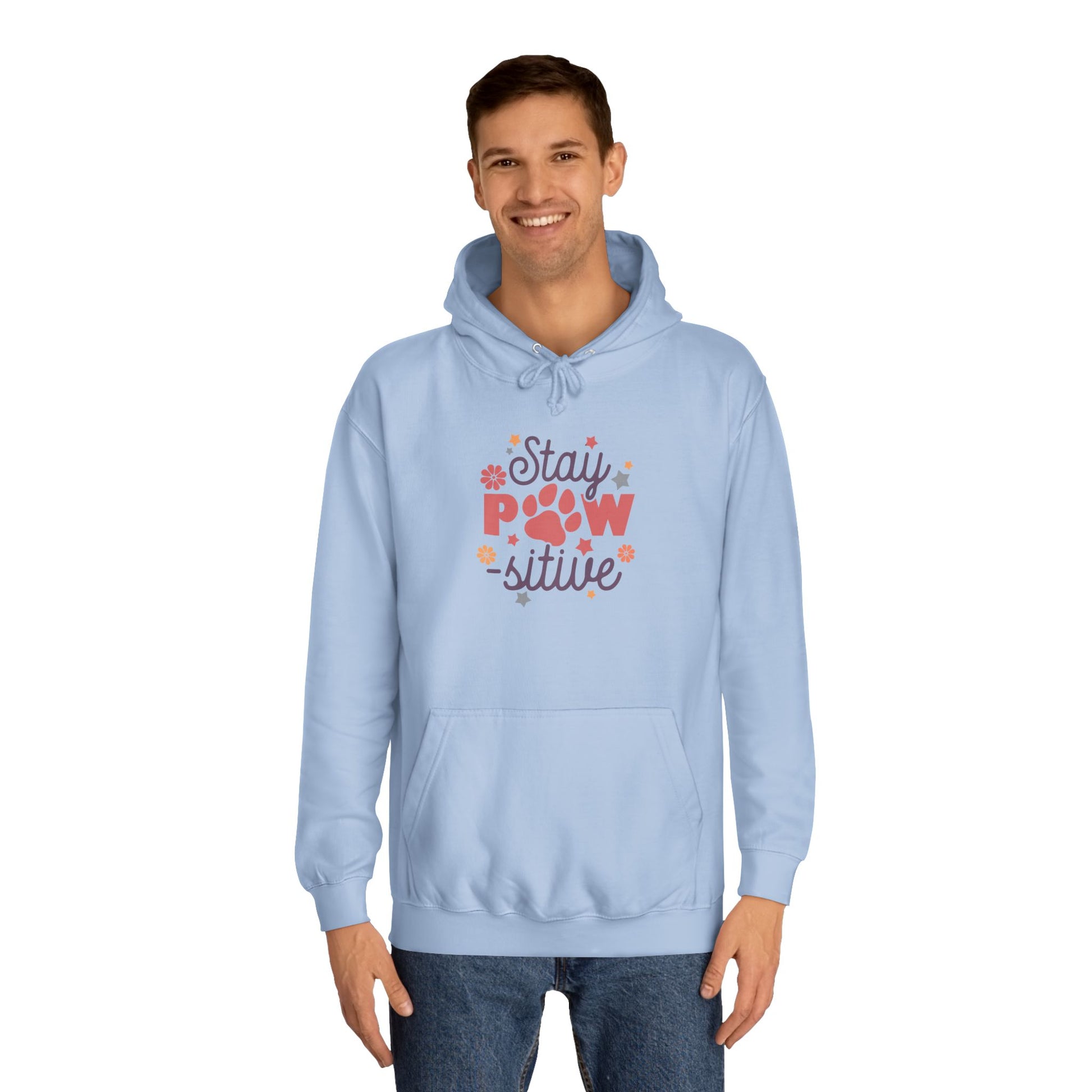 Stay Pawsitive Unisex Hoodie light blue pullover on male model with paw print graphic and kangaroo pocket