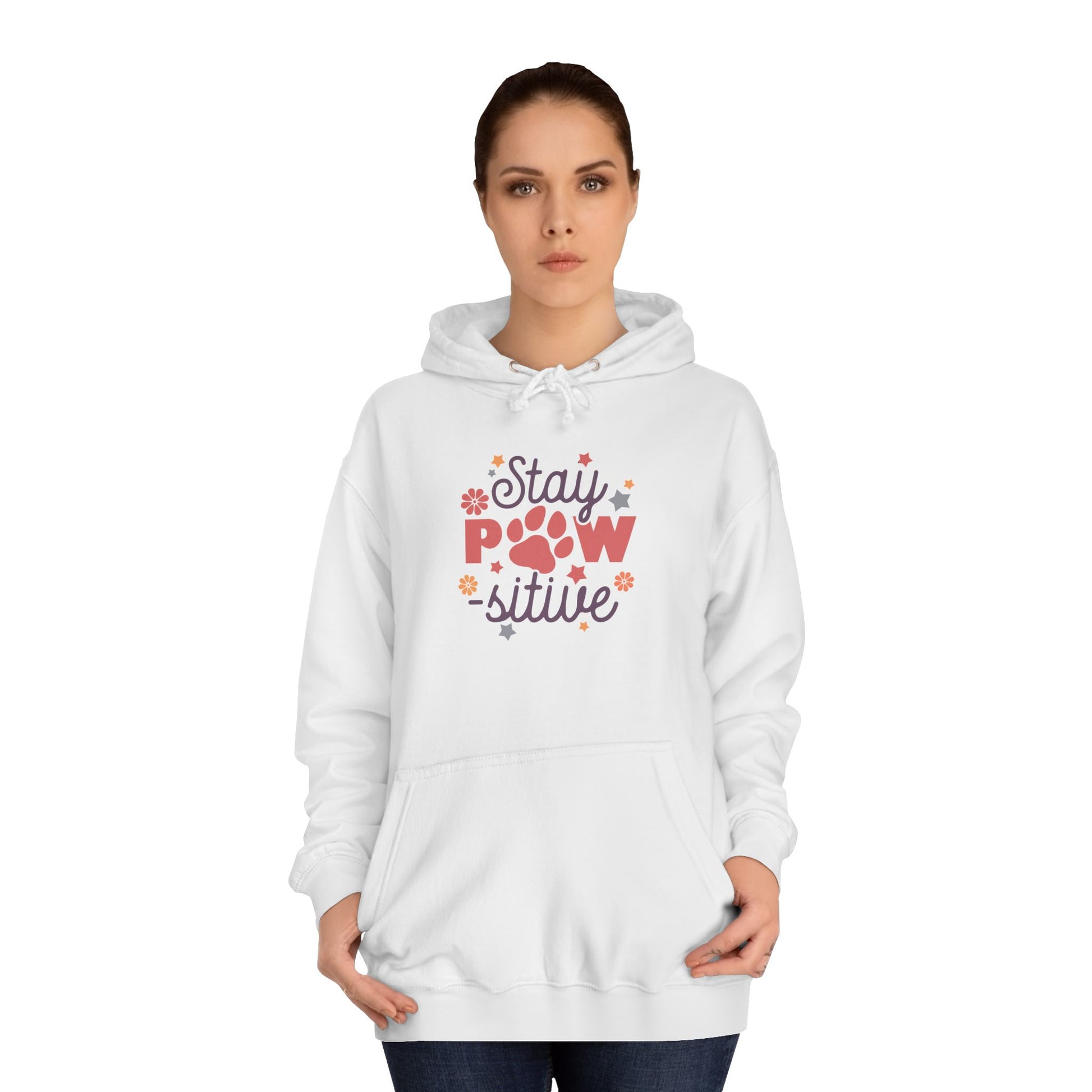 Woman wearing white Stay Pawsitive Unisex Hoodie with paw print and floral graphic front pocket hood casual pet lover gift