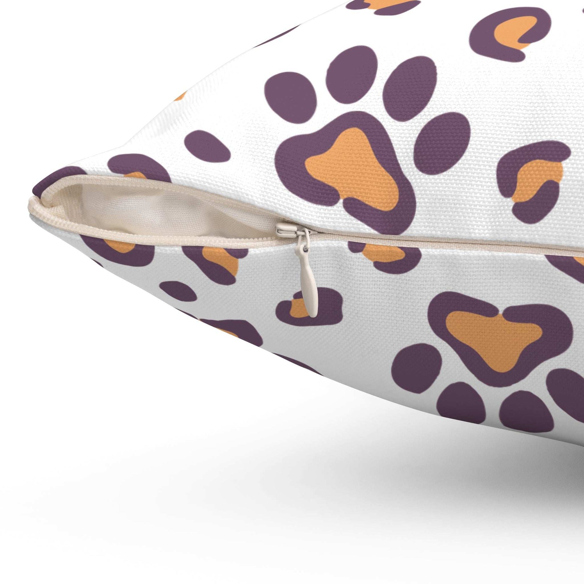 Dog Lovers Pillow white decorative pillow with purple and orange paw print pattern and visible zipper